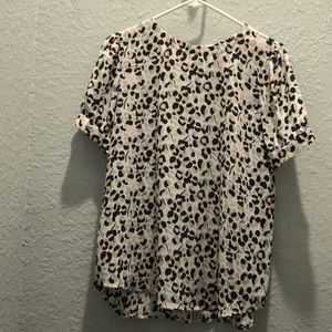 Short sleeve top with back buttons.  Never worn.